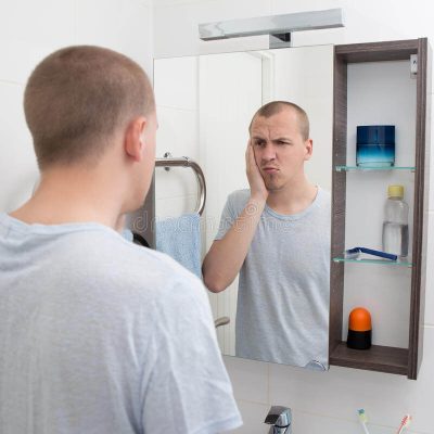 hangover-concept-tired-man-looking-mirror-bathroom-sleepy-55380626-1